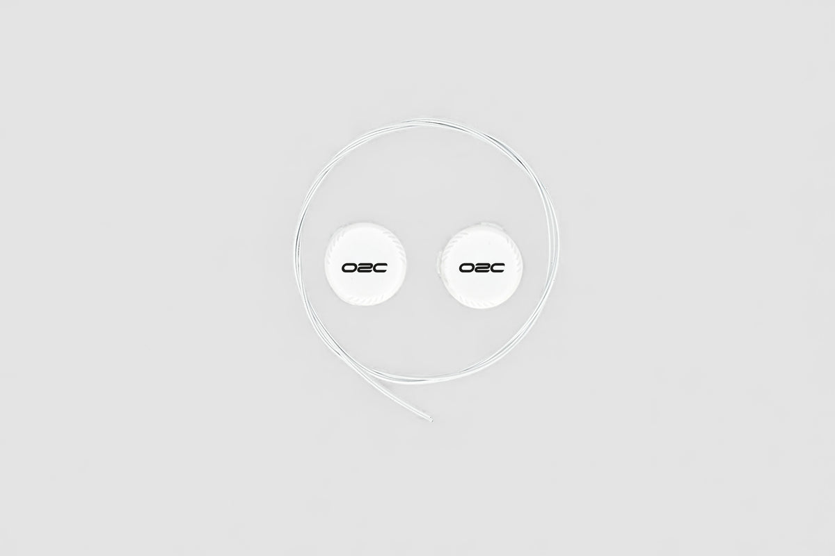Two O2C replacement dials with required cables on white background