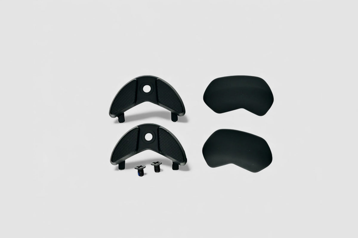 One pair Black TPU heel and front bumper replacement for O2C cycling shoes on white background